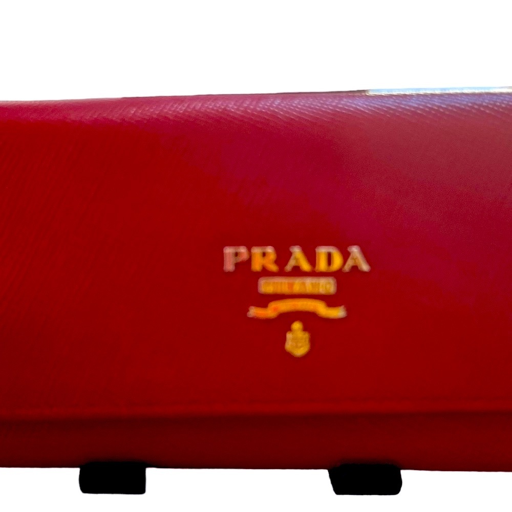 Prada Red Key Holder Wallet. Pre- owned. Good condition.